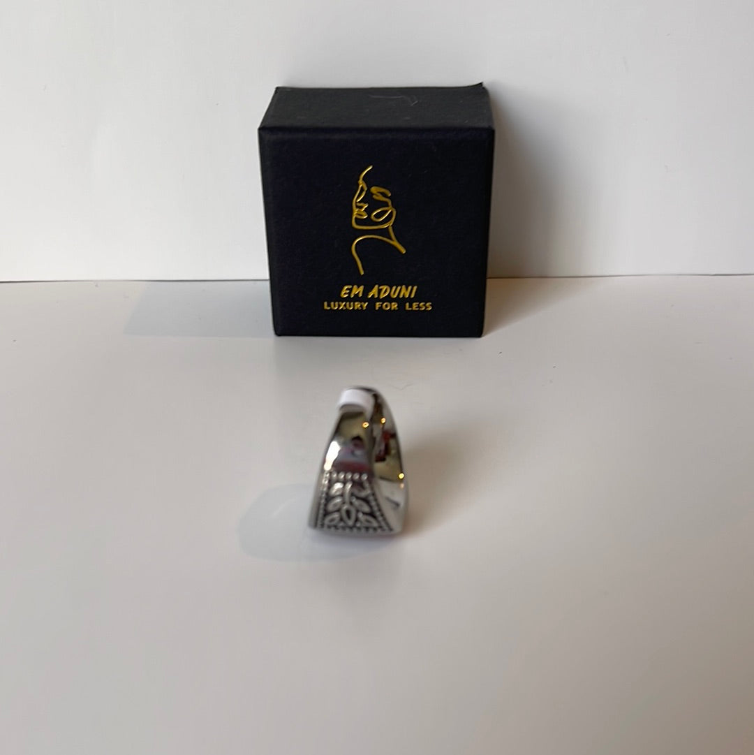 Dark engraved silver red stone